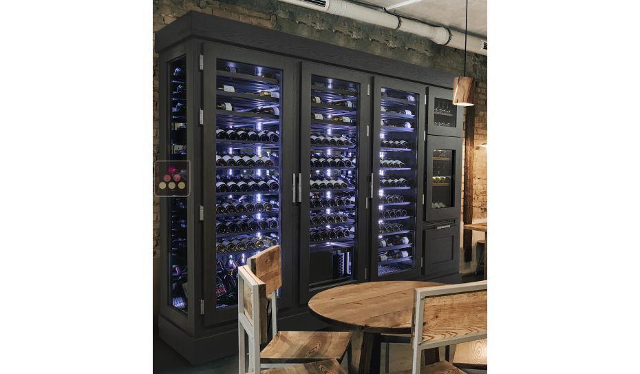 Custom-made ageing wine cabinet with a built-in dual temperature service cabinet and a standing bottles drawer