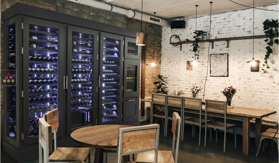 Custom-made ageing wine cabinet with a built-in dual temperature service cabinet and a standing bottles drawer