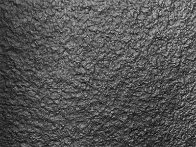 Wooden cladding covered with a textured Black finish laminate